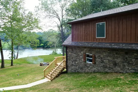 Serene Retreat with River Access and Cozy Amenities - Charming Cabin