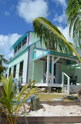 Step from your porch onto the soft white sand & crystal clear water.