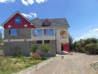 Kathy's Place ( see Lake Naivasha & Hills beyond)