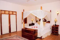 The Crimson Orchid Inn at Orchid Bay - chambre d’hôtes