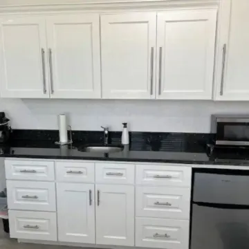 Modern studio apartment with covered outside seating area