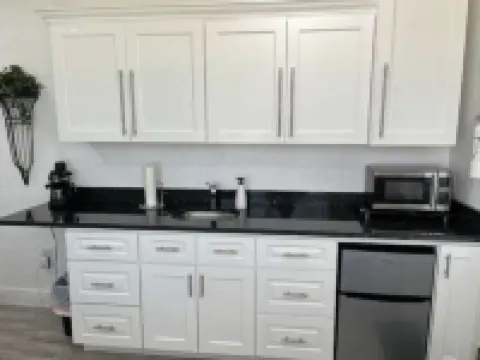 Modern studio apartment with covered outside seating area