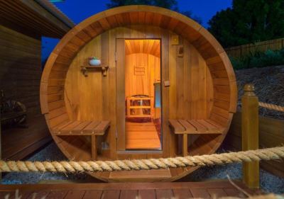 a wooden hot tub with a rope attached to it , surrounded by a wooden fence at The Swan Valley Retreat