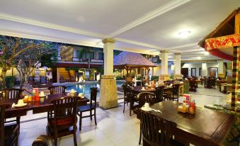 The hotel features a spacious central area with ample seating, perfect for accommodating a large number of guests at The Niche Bali