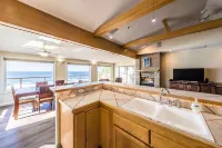 Dramatic oceanfront views. Open high ceilings. Huge deck & walls of windows!