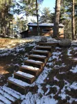 Log home nestled in tall pines near Norway Lake