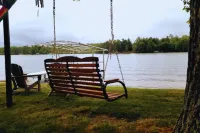 NEW! Renovated Bungalow steps from Lake Tomahawk - King Bed, Dock Space, Firepit