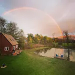 Home with a spring-fed pond and mountain view.