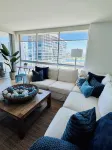 Beach and city views in condo with backyard access to beach and walkable town.