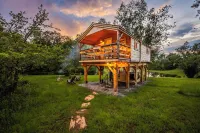 Treehouse lifted up over a stocked trout pond up in the beautiful birch trees!