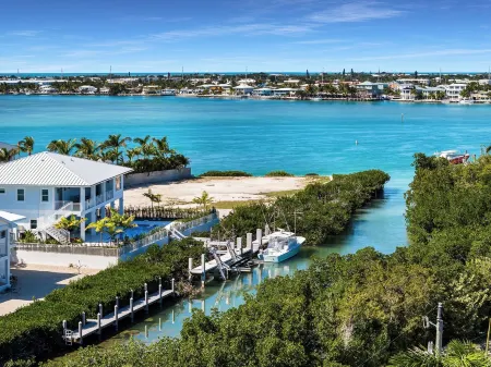 Sophisticated 5-bedroom, elevator, 50' dock, heated pool/spa, sleep 12