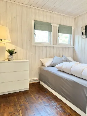 Cozy vacation home in southern Norway (Tromøy, Arendal) with a boat and a pier.