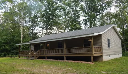 3 Bedroom home with rear deck and covered front porch.