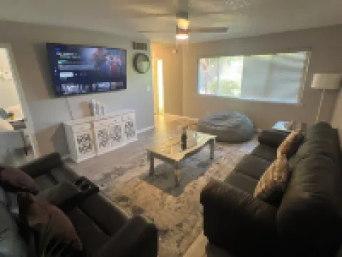 Beautiful Home in quiet neighborhood with a pool and close to stores & highways.