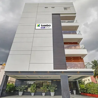 Treebo Premium Raj Vista Global Village 鄰近大榕樹的酒店