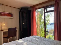 2 Pers. House König Lakeside of the Lauwersmeer with Own Fishing Pier Sauna