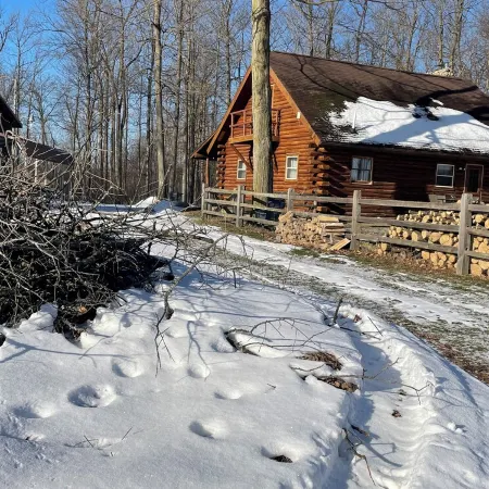 Beautiful log cabin with all the creature comforts of home. Private fishing lake