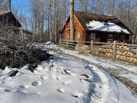 Beautiful log cabin with all the creature comforts of home. Private fishing lake