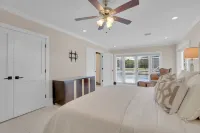 Steps from the beach, heated pool, and ocean sunrises from your patio