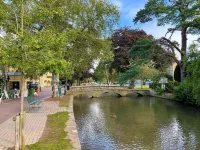 Fairlie Cottage Overlooks the River in Bourton-on-the-Water parking for 3 cars.