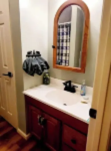 Spacious suite surrounded by nature with living room, fireplace, porch, fire pit