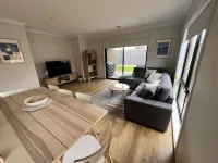 Brand new, spacious family home in walking distance to beach.