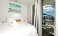 朗博特島距海灘數步之遙的迷人一臥室海濱公寓
