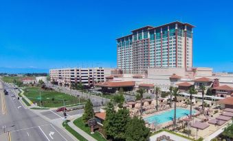 a large hotel with a swimming pool and other amenities is shown from an aerial view at Thunder Valley Casino Resort