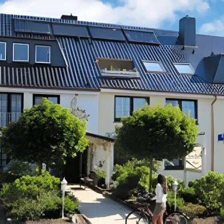 Aparthotel Kleine Perle Отели в г. Куксхафен