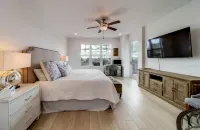 Luxury new condo steps to the beach with Gulf Views, heated pool, & hot tub