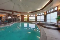 Stunning waterfront villa with indoor pool and kids swing set and play area. - Boutique