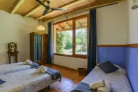 Eco Cottage in charming village in rural Costa Brava. Swimming pool-big garden