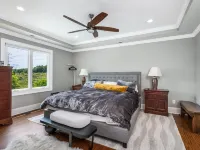 Beautiful Waterfront Home with abundant outdoor seating, pool, hot tub, grill