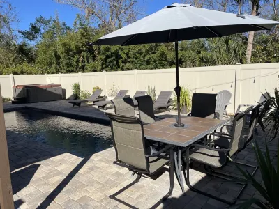 Close to beach! Family-sized home with pool and hot tub.