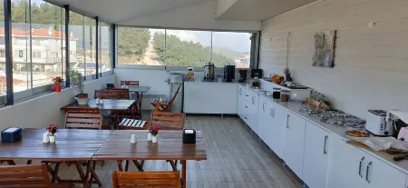 Saatlı Hotel Отели в г. Чешме