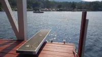 Winnipesaukee lakefront house includes slip, deck, hot tub & sleeps up to 11