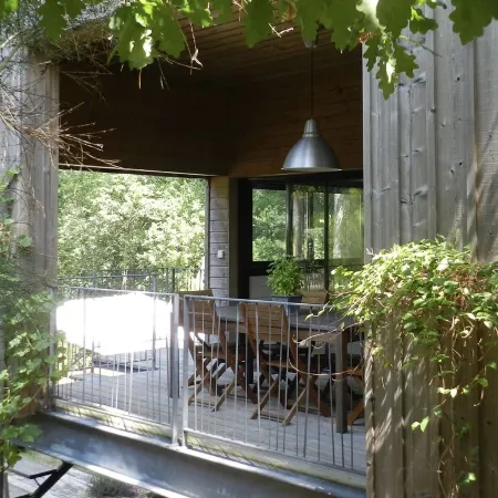 Wooden house in the golf, between forest, lake and ocean