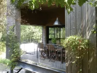 Wooden house in the golf, between forest, lake and ocean