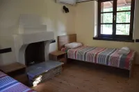 Dendrokipos - traditional stone house on the east side of Pelion Hotels in Mouresi