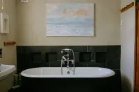 Beautiful hand crafted cottage 5 minutes from sandy beach and rugged coastline! Hotels near The Herring Restaurant