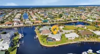 SENSATIONAL!! WATER-VIEW, LUXURY REMODEL, SUNNY HEATED POOL, HUGE 145’ SEA WALL