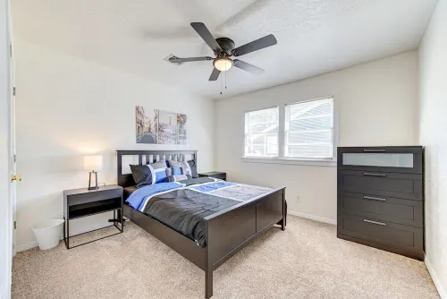 King bed with Pool table, decked patio and, gym.