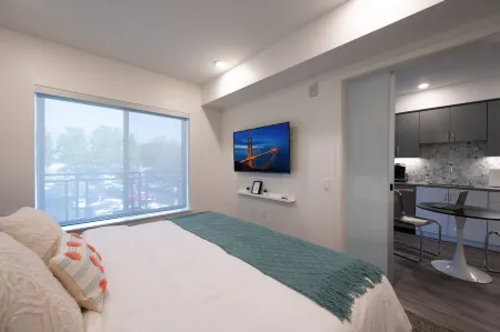 Pets Stay Free • King Bed • Walk to Downtown • Garage Parking • Elevator