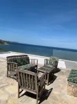 Shorefront villa offers great amenities and views giving onto the beach below Hotels in Corbara