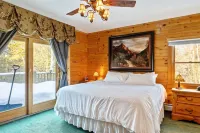 Experience the rustic charm of a log cabin chalet nestled on 14 private acres.