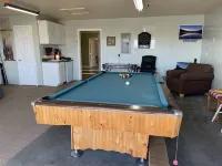 Two bedroom, three bathroom fenced yard. Game room with hide a bed. Pet friendly