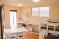 House Hotel Amami Minpaku Mura & Sauna فنادق في أمامي