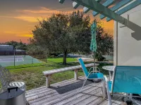 Poolside Oasis with Cozy Fireplace - Charming Coastal Retreat