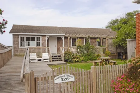 Waterfront Views and Private Deck - Charming Coastal Haven