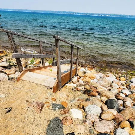 Cozy cabin on Little McDonald with amazing walk out beach!